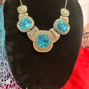 silver tone necklace with blue stones